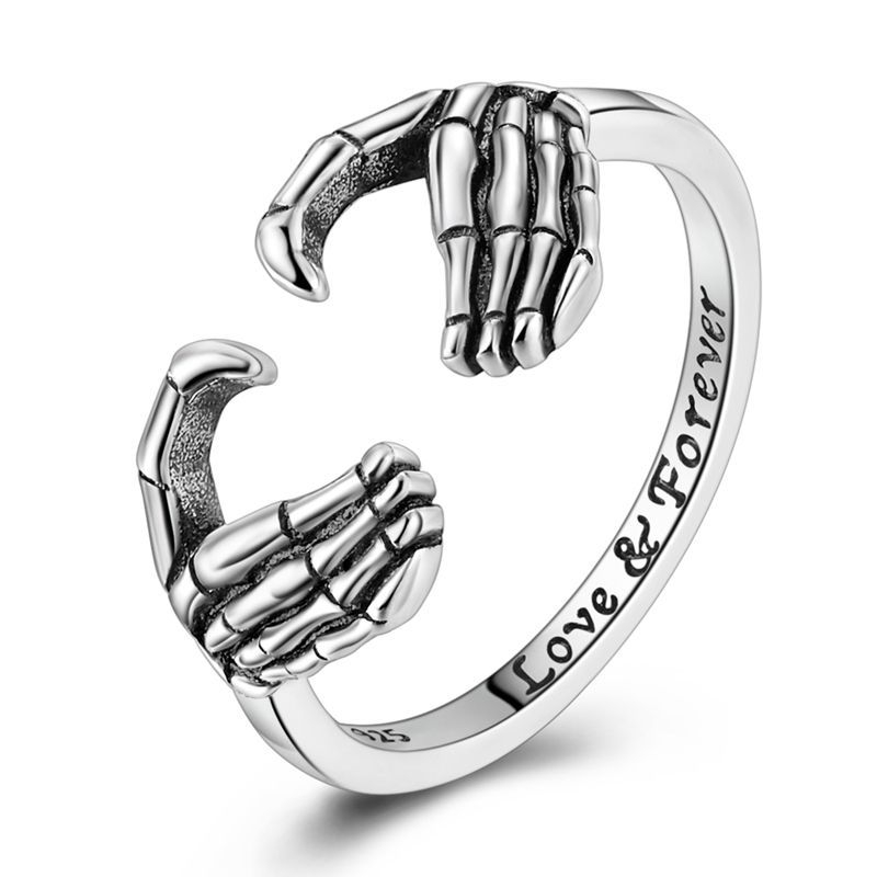 Halloween Holding Love Forever Ring – gothic heart and skeletal hands design, adjustable romantic ring, perfect Halloween gift for couples.